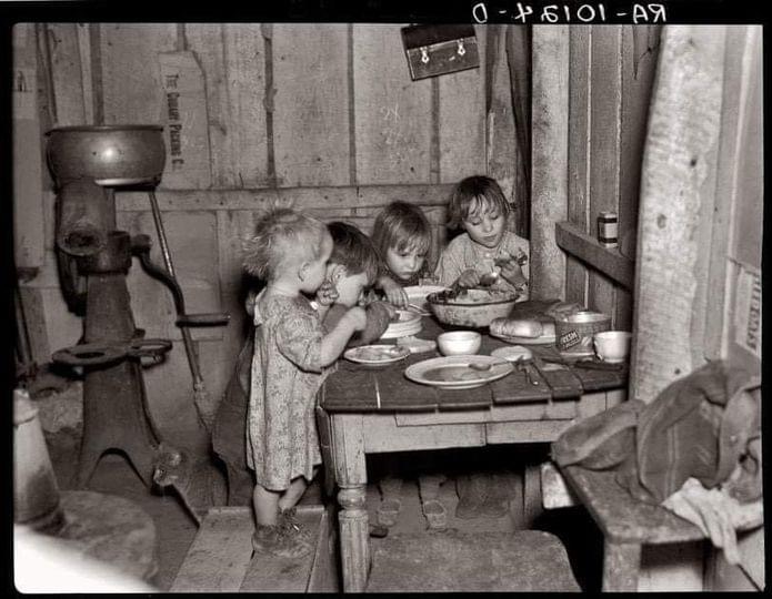 Christmas dinner, 1936. Dinner consisted of potatoes, cabbage and pie. Check the comments